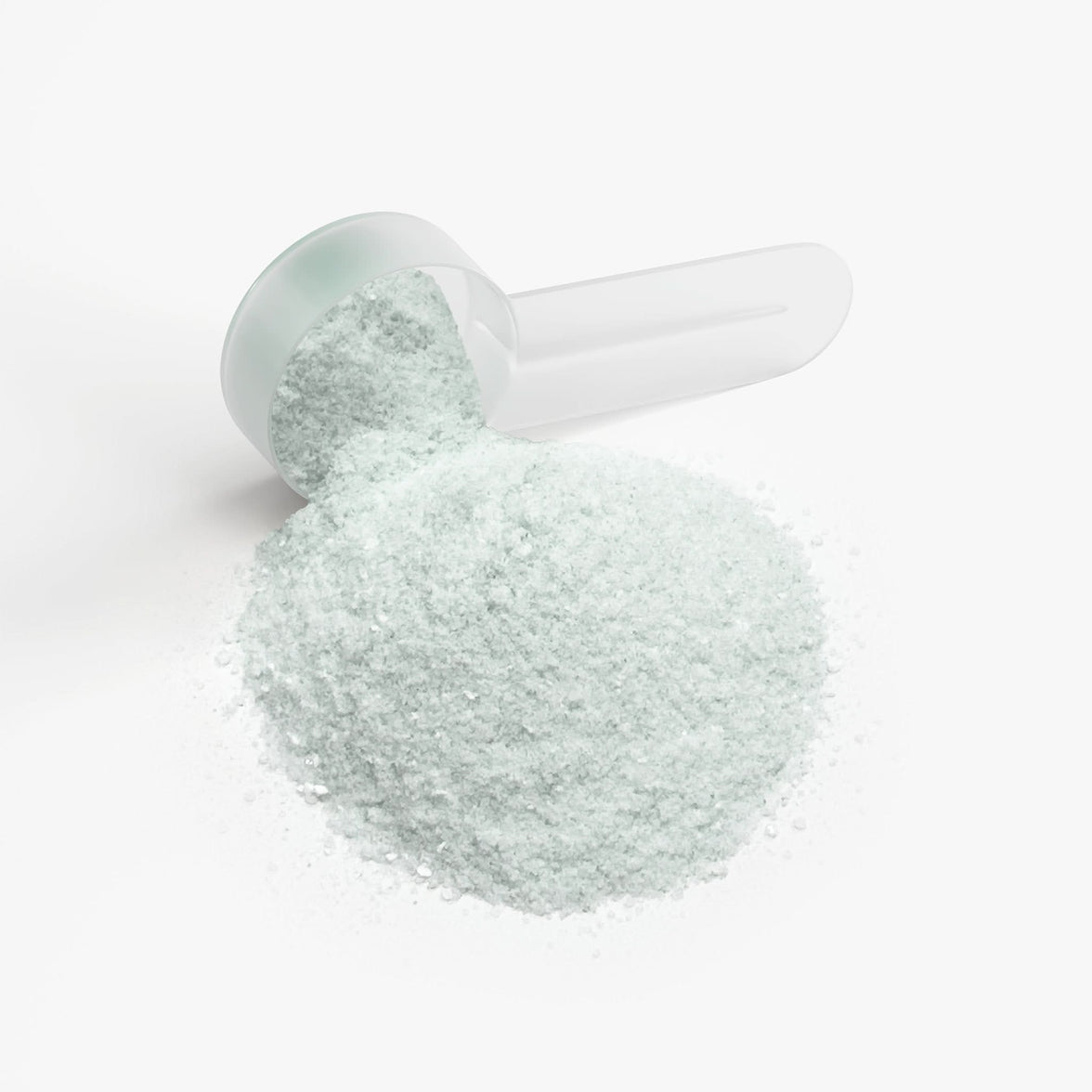 TeqenX ChargeUp Melon Creamsicle energy powder in a scoop, showcasing its light green color for balanced energy without the crash.