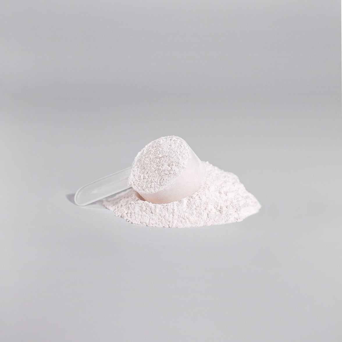 TeqenX ChargeUp+ Fruit Punch pre-workout powder with a scoop and spilled powder, designed for energy, muscle pumps, and focus.