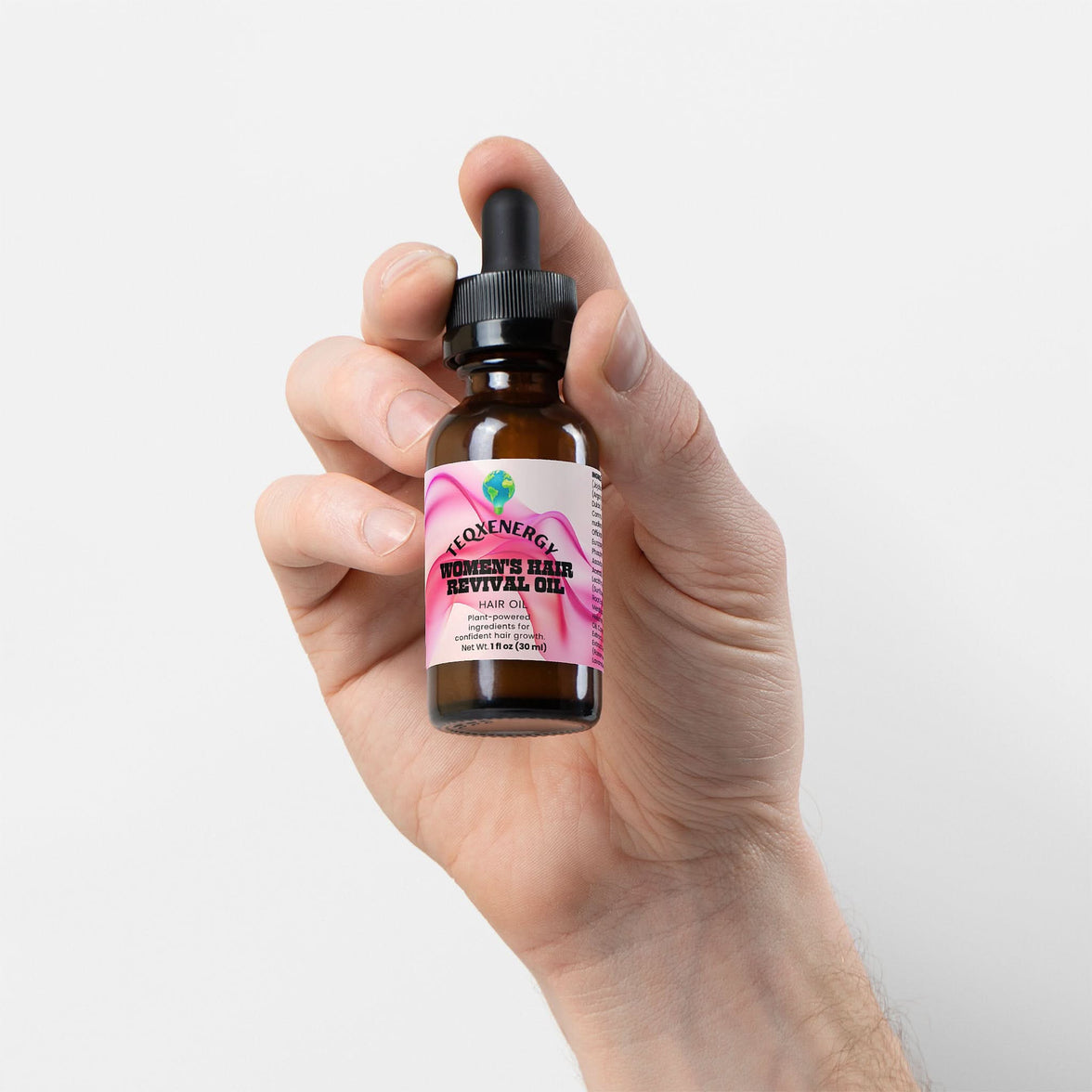 TeqenX Women's Hair Revival Oil in a dark amber dropper bottle, promoting hair growth and scalp health with botanical oils.