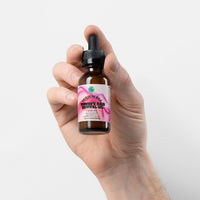 TeqenX Women's Hair Revival Oil in a dark amber dropper bottle, promoting hair growth and scalp health with botanical oils.