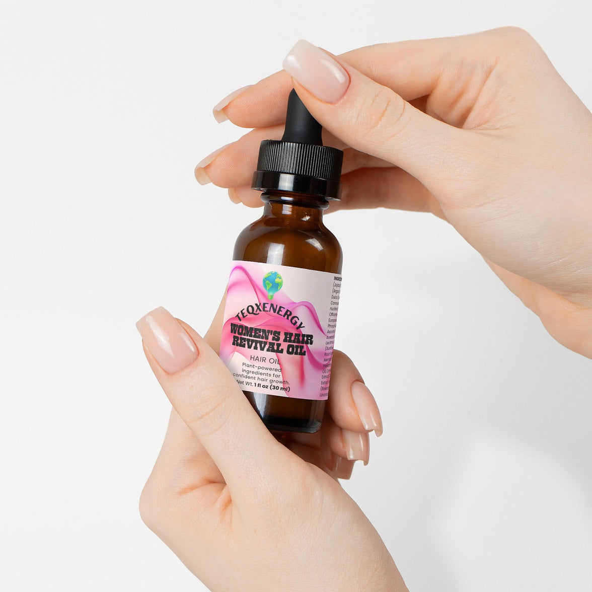 TeqenX Women's Hair Revival Oil in a dropper bottle, promoting hair growth and scalp health with botanical oils and vitamins.