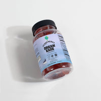 DREAMEASE Gummies in a clear jar with a black lid, featuring melatonin for enhanced REM sleep and a delicious passion fruit flavor.