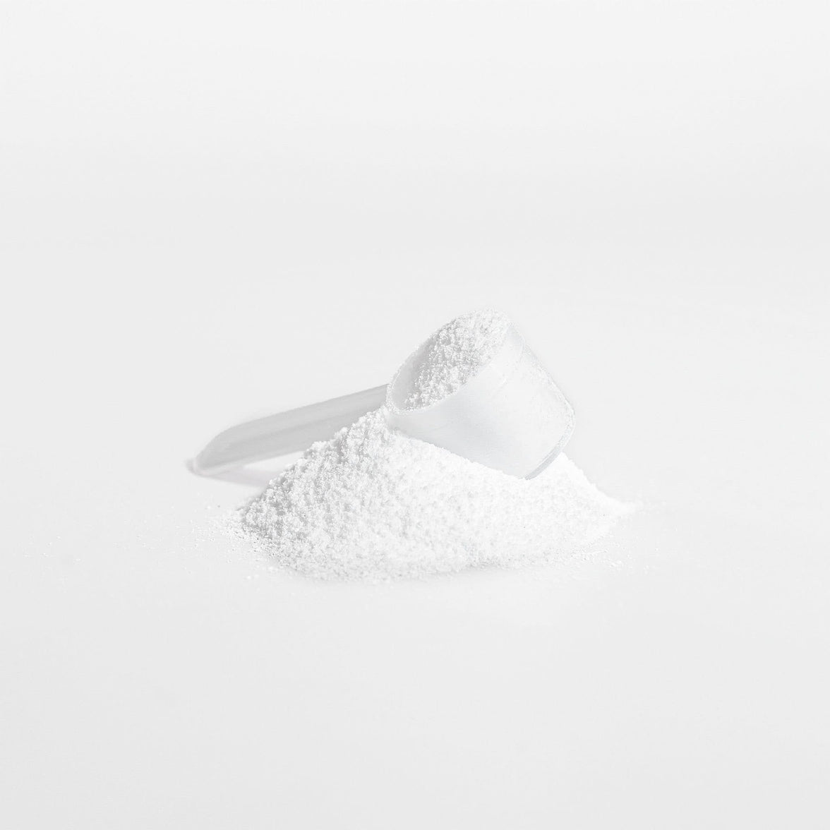 TeqenX Creatine Monohydrate powder in a scoop, designed to boost strength and performance for athletes and fitness enthusiasts.