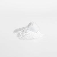TeqenX Creatine Monohydrate powder in a scoop, designed to boost strength and performance for athletes and fitness enthusiasts.